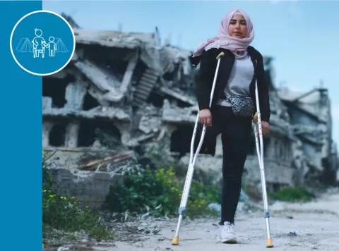 Section C thumbnail: A young girl with a headscarf stands in a ruined city on crutches